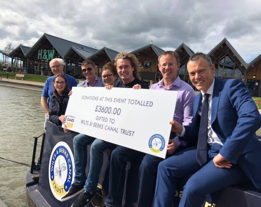 Representatives of all the partners sitting on NB Dragonfly at Waitrose landing stage