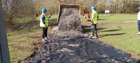 Laying stone to the compound March 2023