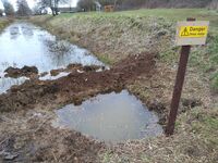 Test pit over leaking culvert