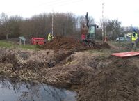 Installing pipes to divert the ditch water through the canal