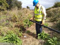 Branch Chairman checking pump flow